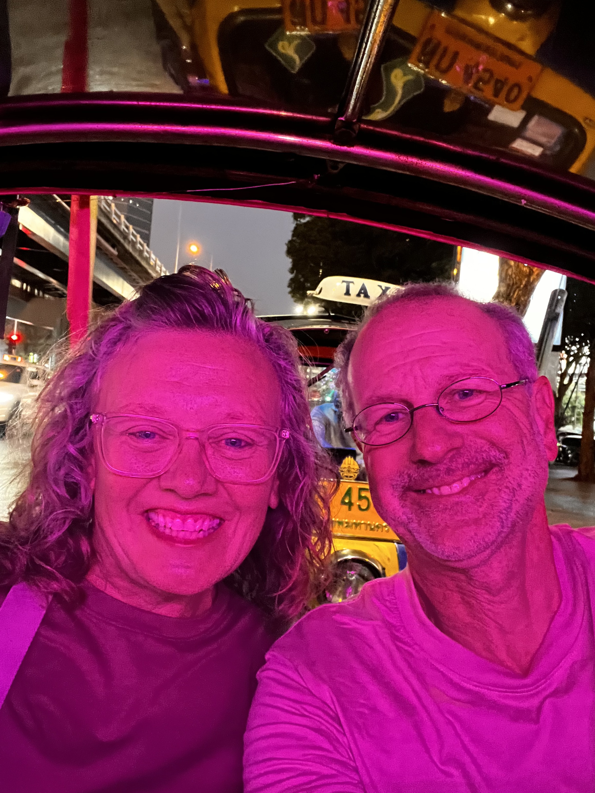 Cheryl and Steve riding in a tuk-tuk at night