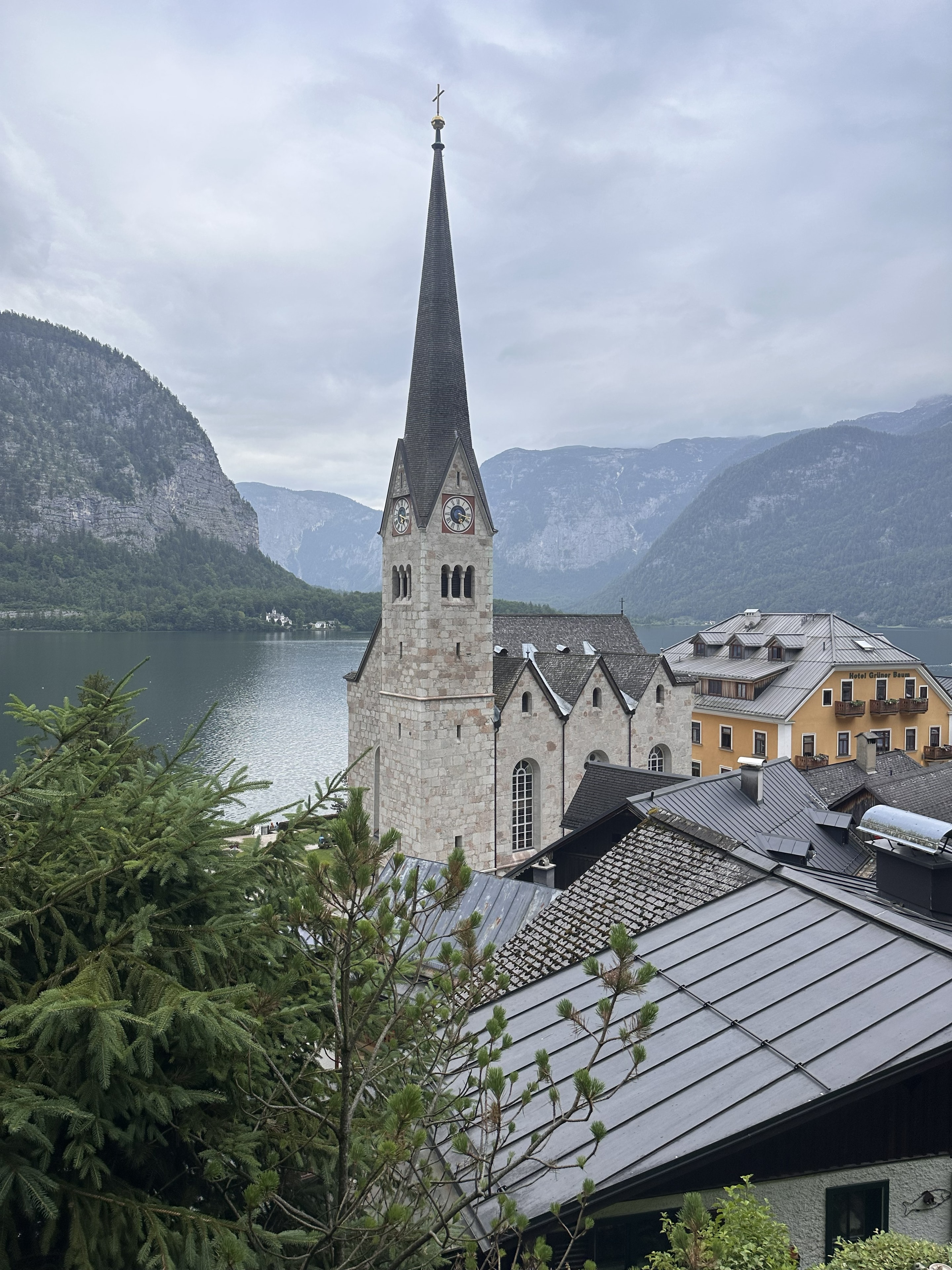 Hallstatt church spire with the lake and mountains behind