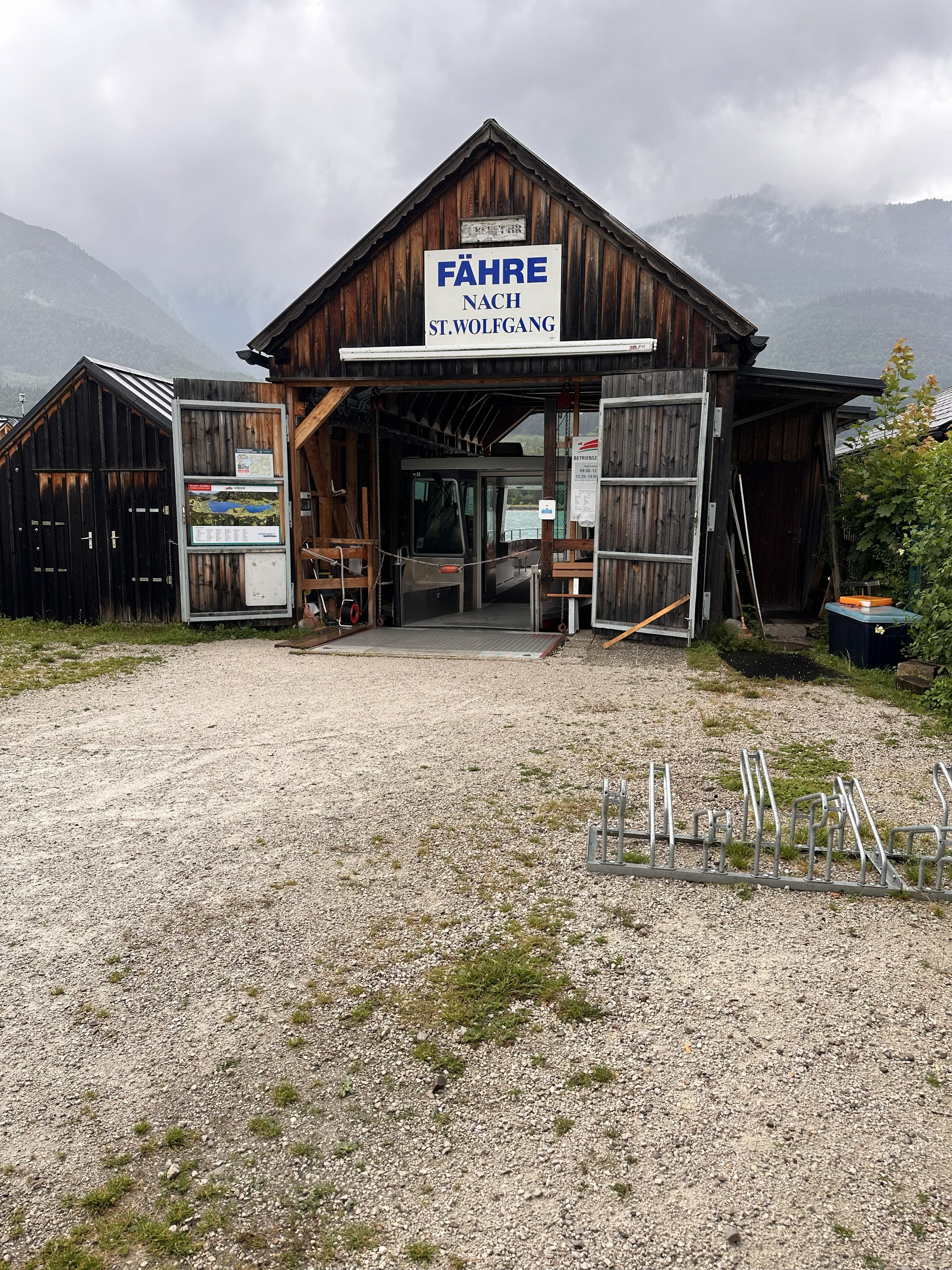 Fähre nach St. Wolfgang boathouse ferry station with Alpine mountains behind